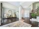 Open living area with hardwood floors, comfortable seating, and access to the staircase at 1680 Laleiah Dr, Cumming, GA 30041