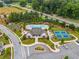Stunning aerial view of community pool, clubhouse, tennis courts, and garden plots beautifully landscaped at 309 Mcdaniel Pl, Canton, GA 30115