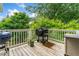 Spacious back deck with a grill, ideal for outdoor cooking and entertaining at 309 Mcdaniel Pl, Canton, GA 30115
