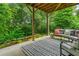 Beautiful outdoor patio featuring wood beams, plush outdoor furniture, and an outdoor garden at 309 Mcdaniel Pl, Canton, GA 30115