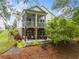 Two-story home with a screened porch and outdoor patio space perfect for entertaining at 309 Mcdaniel Pl, Canton, GA 30115