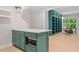 Inviting basement featuring a green bar area with shelving, and a seating area near the window at 309 Mcdaniel Pl, Canton, GA 30115