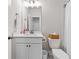 Bright bathroom with white sink, toilet and mirror at 309 Mcdaniel Pl, Canton, GA 30115