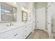 Stylish bathroom featuring a double sink vanity, a glass-enclosed shower, and modern lighting fixtures at 309 Mcdaniel Pl, Canton, GA 30115