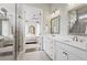 Modern bathroom with dual sinks, granite countertops, shower, and luxury finishes at 309 Mcdaniel Pl, Canton, GA 30115