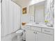 All-white bathroom with shower and tub combination, offering plenty of cabinet storage and counter space at 309 Mcdaniel Pl, Canton, GA 30115
