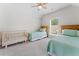 Cozy bedroom featuring two beds, a crib, and soft carpet, perfect for  at 309 Mcdaniel Pl, Canton, GA 30115