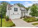 Beautiful home showcasing manicured lawn, tasteful landscaping and a welcoming front porch at 309 Mcdaniel Pl, Canton, GA 30115