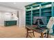 Home office space with a large built-in bookshelf, a desk, and a chair at 309 Mcdaniel Pl, Canton, GA 30115