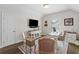 Charming home office featuring hardwood floors, a stylish desk, and a cozy seating area at 309 Mcdaniel Pl, Canton, GA 30115