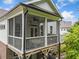 Charming screened porch with a ceiling fan, perfect for enjoying the outdoors bug-free at 309 Mcdaniel Pl, Canton, GA 30115