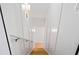 Bright and airy stairway with white walls, modern lighting, and hardwood steps at 309 Mcdaniel Pl, Canton, GA 30115
