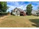 Expansive backyard featuring a deck and lush lawn, ideal for outdoor entertaining and relaxation at 3885 Lake Juliette Dr, Buford, GA 30519