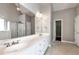 Bathroom featuring a long countertop, double sinks, and a walk-in shower at 3885 Lake Juliette Dr, Buford, GA 30519