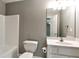 Bathroom with a white single vanity, tub and shower combination at 3885 Lake Juliette Dr, Buford, GA 30519