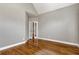 Spacious bedroom featuring hardwood floors and French doors to another room at 3885 Lake Juliette Dr, Buford, GA 30519