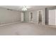 Spacious bonus room features neutral walls and recessed lighting at 3885 Lake Juliette Dr, Buford, GA 30519