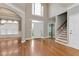 Grand foyer with soaring ceilings, hardwood floors, and an abundance of natural light at 3885 Lake Juliette Dr, Buford, GA 30519