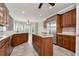 Kitchen with wooden cabinets, granite countertops, stainless steel appliances, and island at 3885 Lake Juliette Dr, Buford, GA 30519