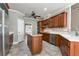 Well-equipped kitchen with stainless appliances, center island, and wooden cabinetry at 3885 Lake Juliette Dr, Buford, GA 30519