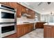 Close-up of modern kitchen with stainless steel appliances and tile backsplash at 3885 Lake Juliette Dr, Buford, GA 30519