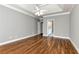 Large bedroom features hardwood floors and en suite bathroom with bright natural light at 3885 Lake Juliette Dr, Buford, GA 30519