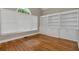 Bright office space with built-in bookshelves, hardwood floors, and natural light at 3885 Lake Juliette Dr, Buford, GA 30519