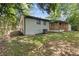 Charming home's backyard with a view of wooden porch and fenced yard on a sunny day at 4345 Sasanqua Ct, Tucker, GA 30084