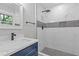 Sleek bathroom featuring a tiled shower with niche, modern fixtures, and a stylish vanity at 4345 Sasanqua Ct, Tucker, GA 30084