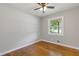 Cozy bedroom with hardwood floors, a ceiling fan, and a window providing natural light at 4345 Sasanqua Ct, Tucker, GA 30084