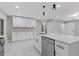 A modern kitchen showcasing an island, stainless steel appliances, and stylish fixtures and hardware at 4345 Sasanqua Ct, Tucker, GA 30084