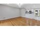Open-concept layout of the living room and kitchen featuring hardwood floors and modern lighting at 4345 Sasanqua Ct, Tucker, GA 30084