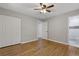 Spacious main bedroom features hardwood floors and an attached bathroom with tiled shower at 4345 Sasanqua Ct, Tucker, GA 30084