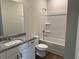 Bathroom with shower-tub combo, granite vanity, toilet and hardwood floors at 57 Longhorn Way, Auburn, GA 30011