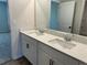 Bright bathroom boasts double sinks, sleek fixtures, and a clean, modern design at 57 Longhorn Way, Auburn, GA 30011