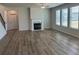 Living room with fireplace, vinyl floors and bright sunlight at 57 Longhorn Way, Auburn, GA 30011