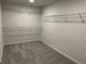 Walk-in closet with shelving provides ample storage space and organization at 57 Longhorn Way, Auburn, GA 30011