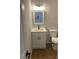 Bright bathroom featuring a white vanity, modern fixtures, and a matching toilet for a clean aesthetic at 5920 Findley Chase Dr, Johns Creek, GA 30097