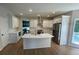 Bright kitchen featuring white cabinets, stainless steel appliances, and a marble top island at 5920 Findley Chase Dr, Johns Creek, GA 30097