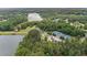 An aerial view of a lake community with a lake, tennis courts, houses and a clubhouse at 140 Discovery Lake Dr, Fayetteville, GA 30215