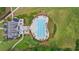 Aerial view of the community pool and clubhouse surrounded by landscaping and walking paths at 140 Discovery Lake Dr, Fayetteville, GA 30215