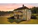 Expansive backyard featuring a deck, outdoor living space, and plenty of green space for recreation at 140 Discovery Lake Dr, Fayetteville, GA 30215