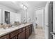 Bathroom featuring a granite countertop, dual sinks, and modern fixtures at 140 Discovery Lake Dr, Fayetteville, GA 30215