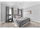 Bedroom with neutral walls and carpet with gray quilted bedspread at 140 Discovery Lake Dr, Fayetteville, GA 30215