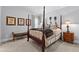 Bedroom features a four-poster bed, neutral walls, and classic decor at 140 Discovery Lake Dr, Fayetteville, GA 30215