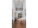 Elegant two-story foyer with hardwood floors, a decorative chandelier, and a view of the staircase at 140 Discovery Lake Dr, Fayetteville, GA 30215