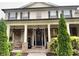 Inviting front entrance with a decorative door, stone accents, and well-manicured landscaping at 140 Discovery Lake Dr, Fayetteville, GA 30215