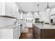 Stylish kitchen featuring white cabinets, granite countertops, and stainless steel appliances at 140 Discovery Lake Dr, Fayetteville, GA 30215