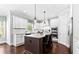 Modern kitchen with white cabinets, granite countertops, and a center island with seating at 140 Discovery Lake Dr, Fayetteville, GA 30215