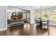 Open-concept living and dining areas with hardwood floors and lots of natural light at 140 Discovery Lake Dr, Fayetteville, GA 30215